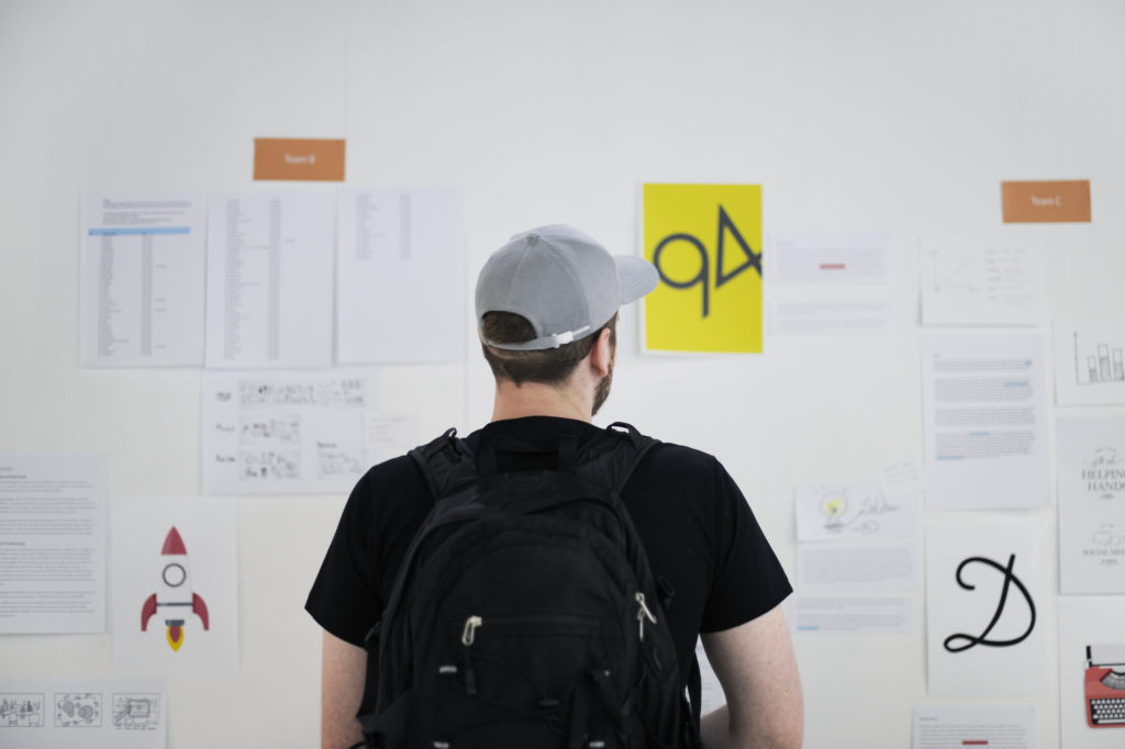 Man looking at board at a Daily Scrum